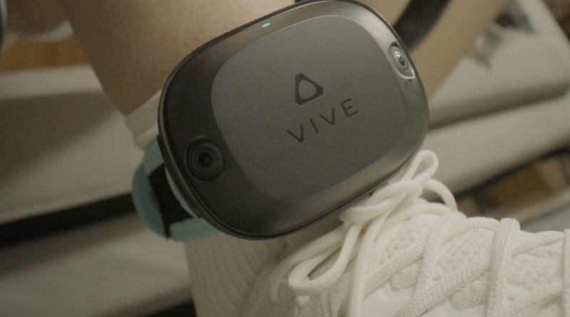 Closeup of VIVE Ultimate Trackers worn on a person’s ankles