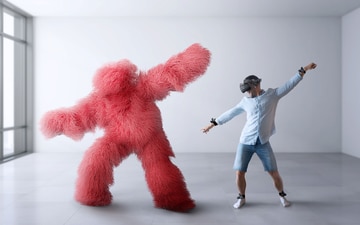 Dancing man wearing VIVE Trackers next to animated creature