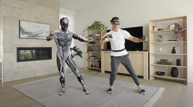 Man with VIVE XR Elite and VIVE Ultimate Trackers, the standalone VR headset and trackers from HTC VIVE, standing next to an avatar