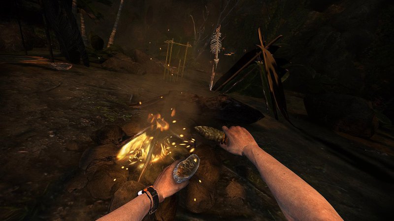 Sitting next to a campfire started with a rock and flint in the Amazon rainforest in Green Hell VR