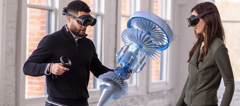 Two corporate professionals using VIVE XR Elite standalone headsets for design collaboration