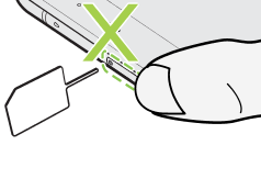 Illustration warning not to press the tray when inserting the eject tool.