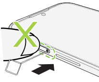 Illustration warning not to press the tray when inserting the eject tool.